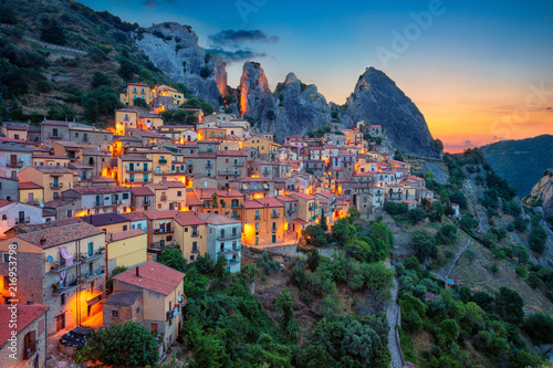 Castelmezzano, Italy. Cityscape aerial image of medieval city of Castelmazzano, Italy during beautiful sunrise. photo