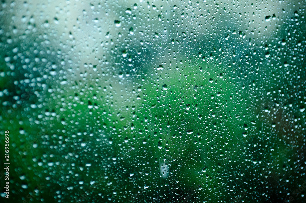 Drops of water on the glass, window. Rainy weather in the summer. Drops of water on the glass, window. Rainy weather in the summer.