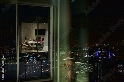 Multi-ethnicity business colleagues in office at night