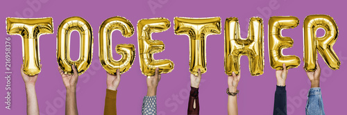 Yellow gold alphabet balloons forming the word together