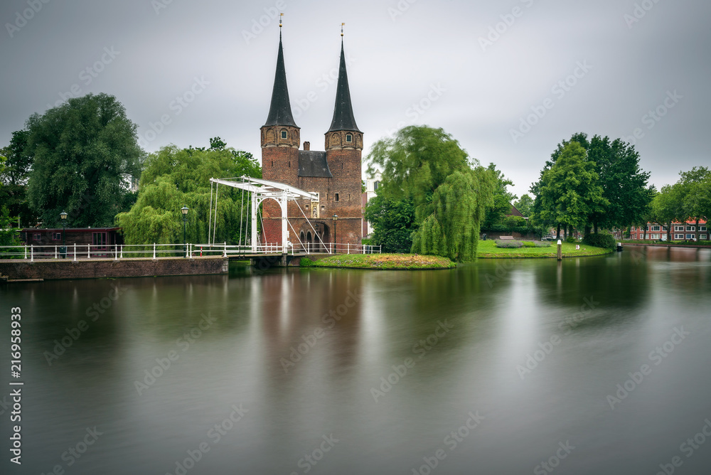 Eastern gate, canal and historic drawbridge in Delft, Netherland Eastern gate, canal and historic drawbridge in Delft, Netherland