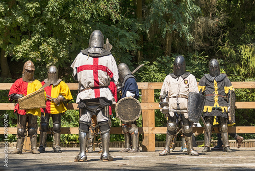 Participant of the festival in knight armor prepares for a battle