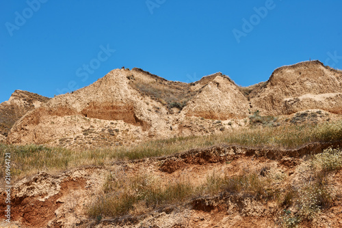 beautiful sea summer landscape, wild beach closeup, sea coast with high hills and cloudy sky © soleg