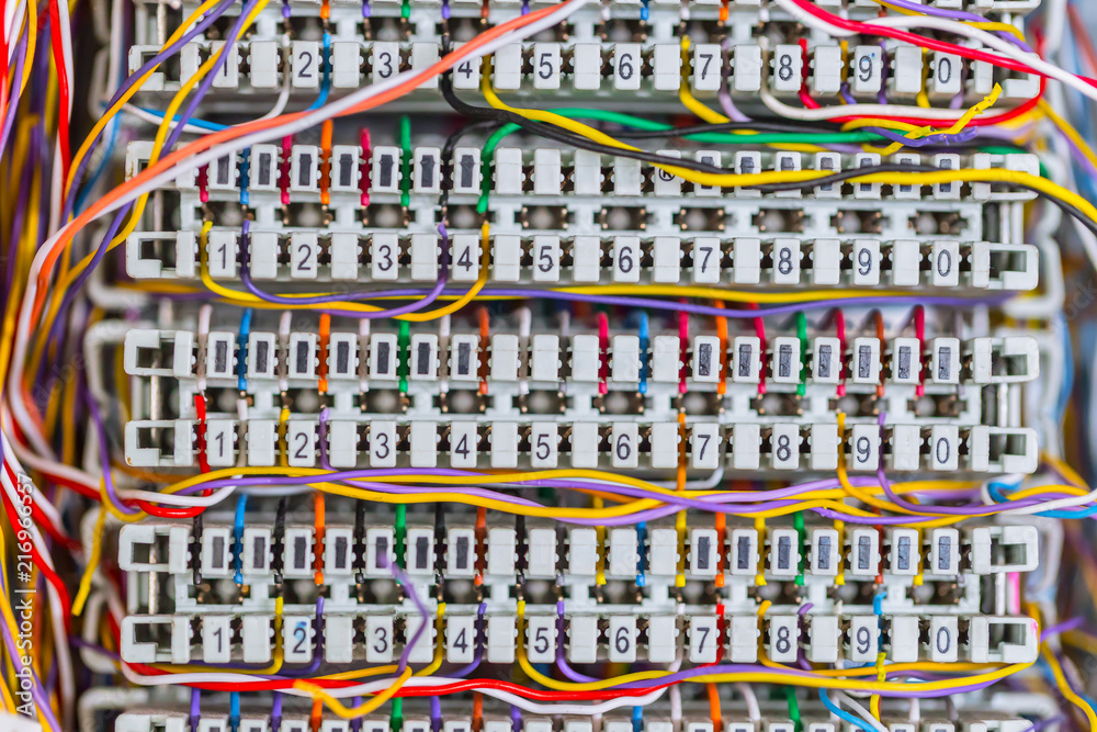 Complex massy managed colorful telephone cable lines in analog PBX box