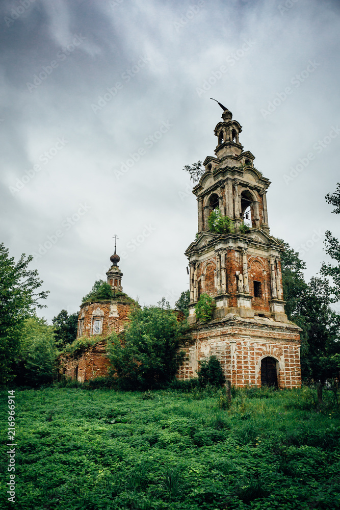 Abandoned and ruined ancient Orthodox Russian Church with tower