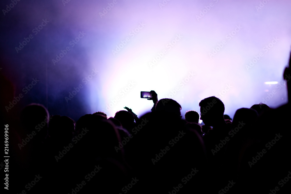 cheering crowd with raised hands at concert - music festival cheering crowd with raised hands at concert - music festival
