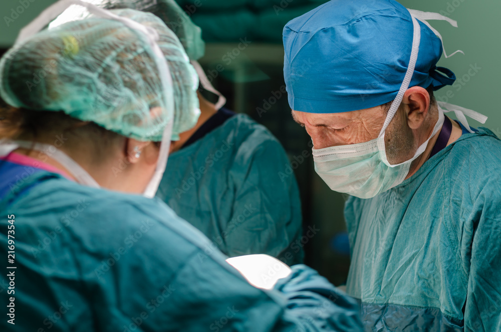 The surgeon at work in operating room. The surgeon at work in operating room.