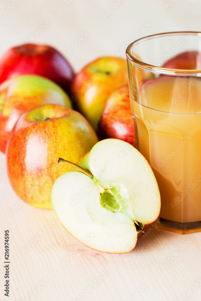 Glass of fresh apple juice and half apple near autumn apples. Glass of fresh apple juice and half apple near autumn apples.