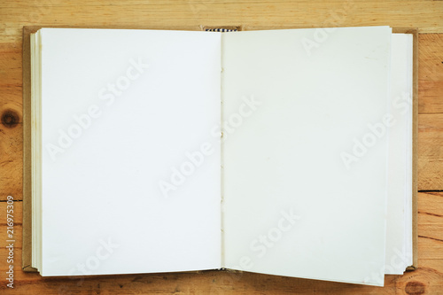 Opened notebook on wooden b...