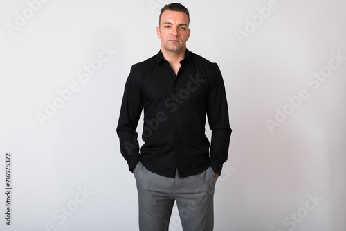 Portrait Of Handsome Businessman Against White Background