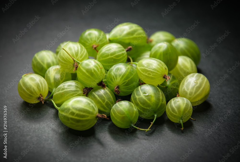 Berries of gooseberries on a dark background.