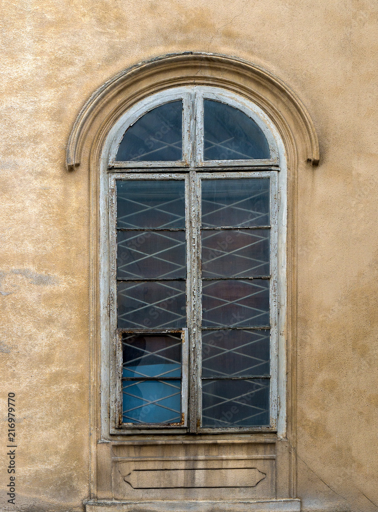 Windows on the facade of houses in the old city Windows on the facade of houses in the old city