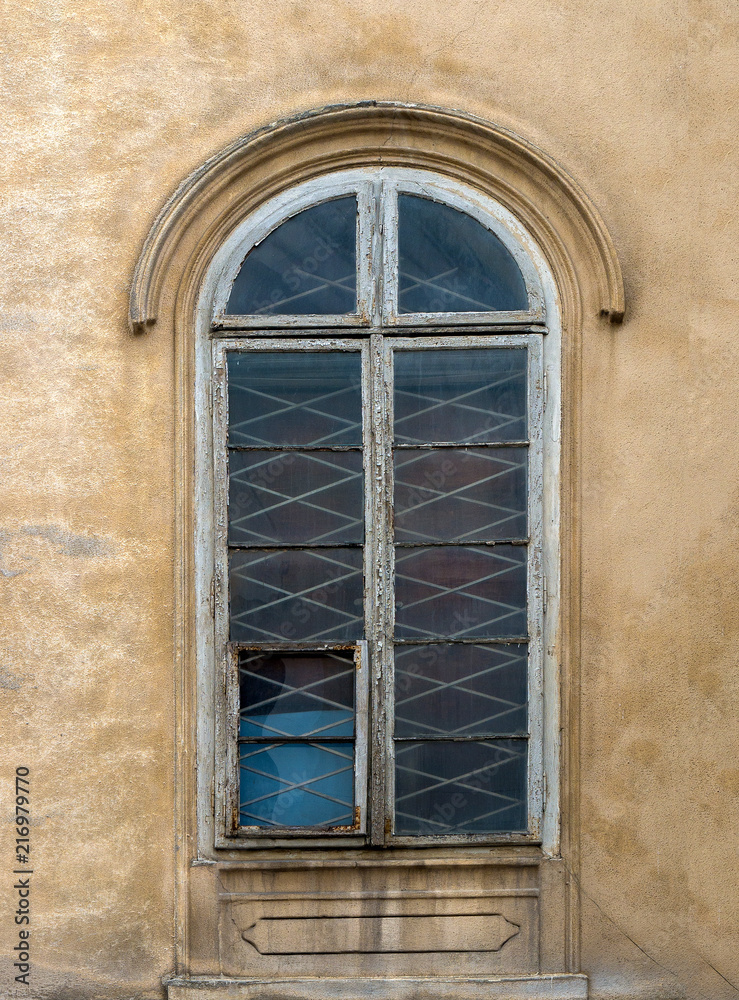 Windows on the facade of houses in the old city