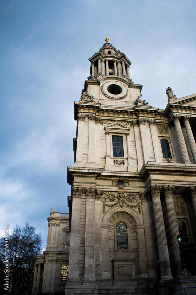 An old church or building in London, England on a cold day with a grey sky with clouds