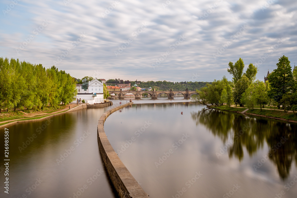 Sov's mills on the Vltava River, in the background of Charles Bridge