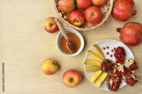 Apples with honey and pomegranate, Jewish New Year celebration, top view, copy space.