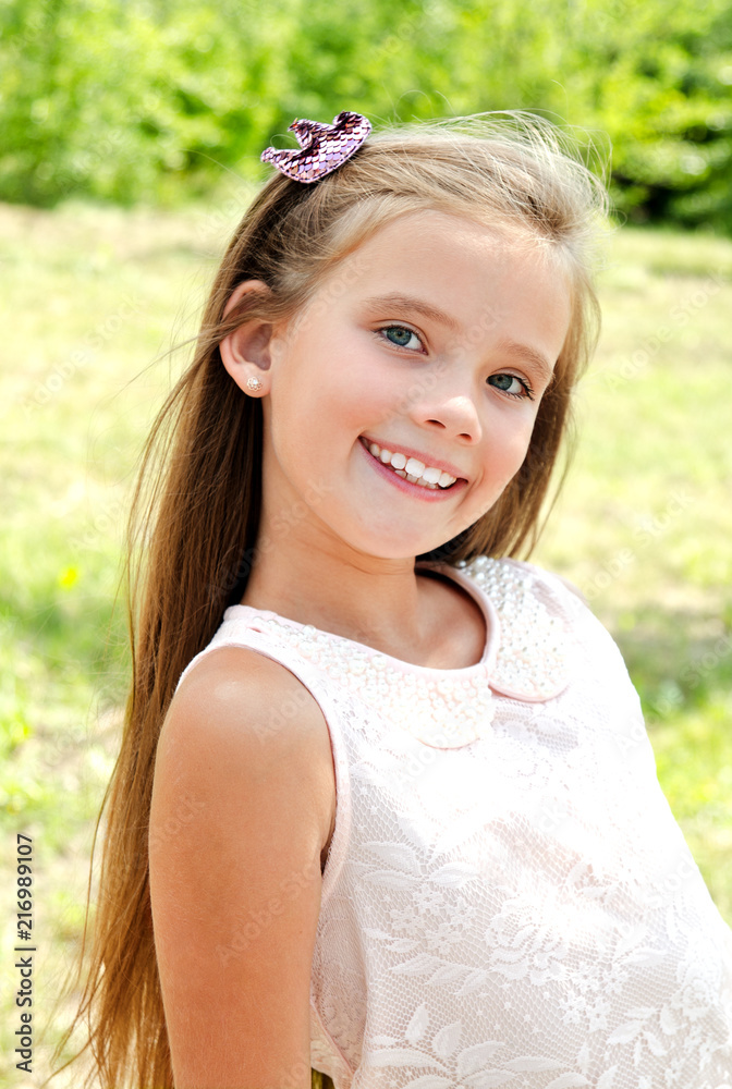 Portrait of adorable smiling little girl outdoors Portrait of adorable smiling little girl outdoors