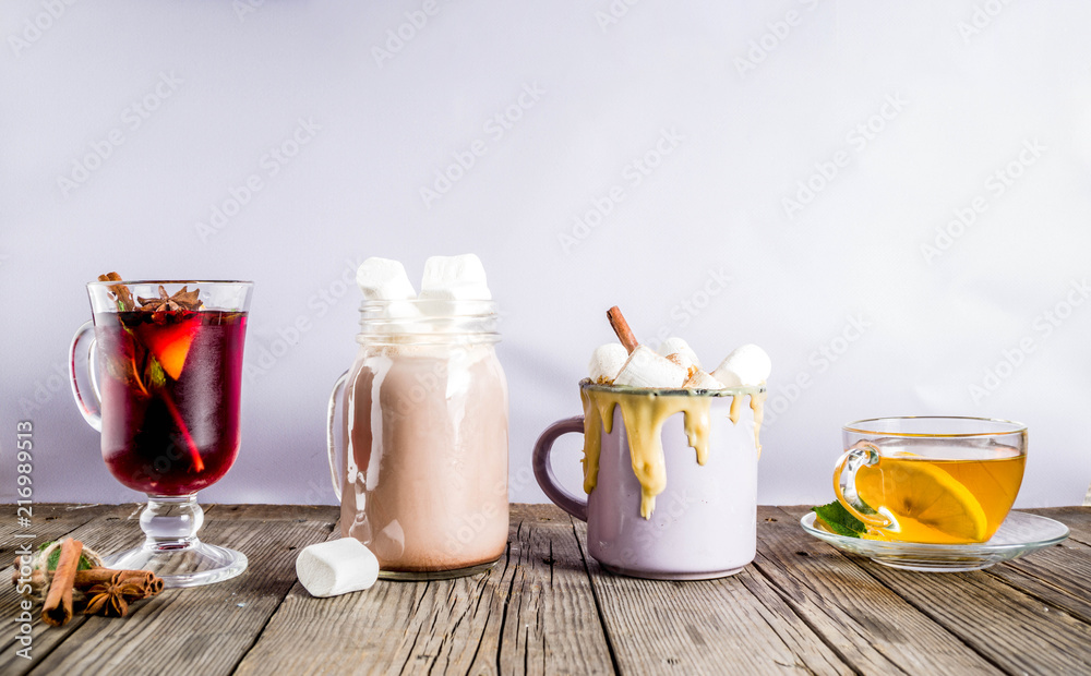 Variations winter autumn traditional drinks - pumpkin latte, hot chocolate, tea with lemon, mulled wine, copy space Variations winter autumn traditional drinks - pumpkin latte, hot chocolate, tea with lemon, mulled wine, copy space