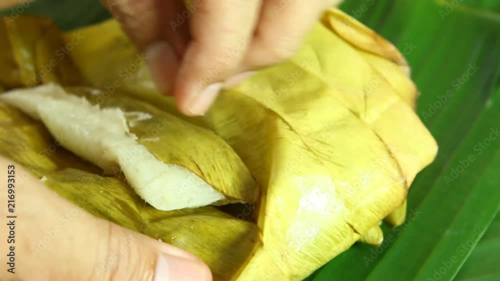 glutinous rice steamed  in banana leaf or Khao tom mat , Thai dessert