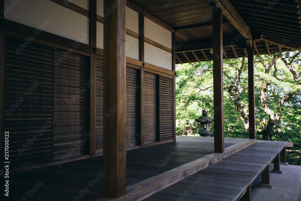 Naklejka premium Outdoors walkway traditional japanese wooden buildings and garden background