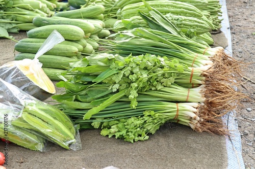Spring onions and coriander at market