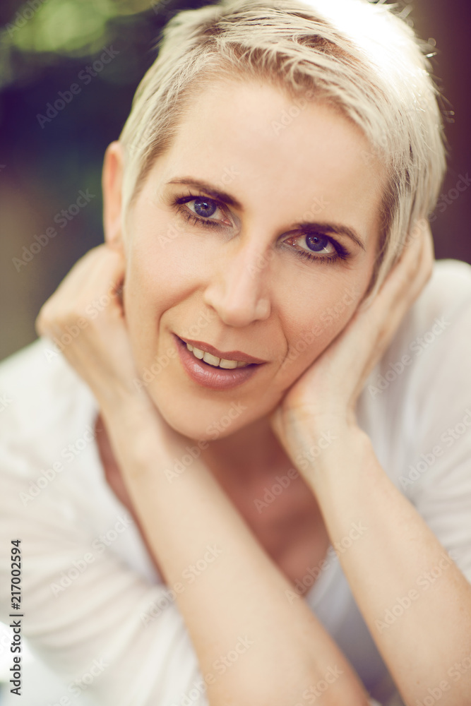 beautiful and self confident middle aged woman portrait close up, outdoor scene beautiful and self confident middle aged woman portrait close up, outdoor scene