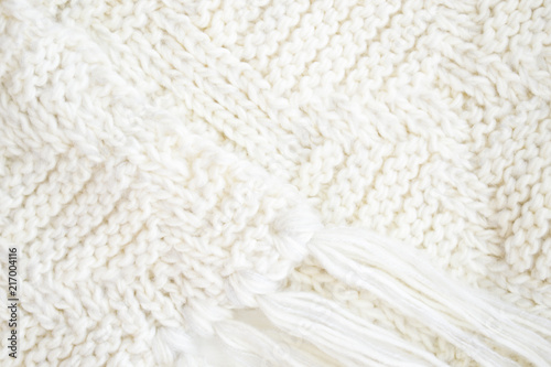 knitted wool carpet close-up. Textile texture. Natural woolen fabric