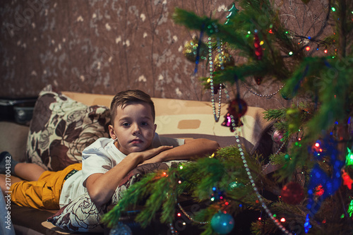 Sad boy portrait on New Yea...