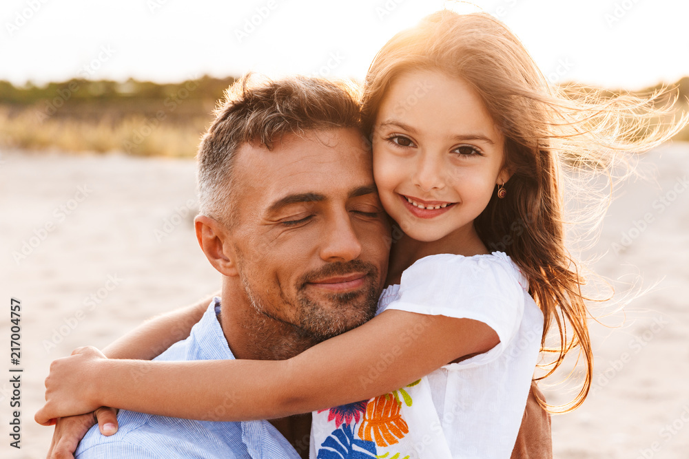 Family having fun together outdoors at the beach. Family having fun together outdoors at the beach.