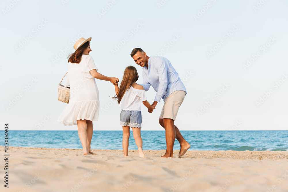 Happy family having fun together at the beach. Happy family having fun together at the beach.