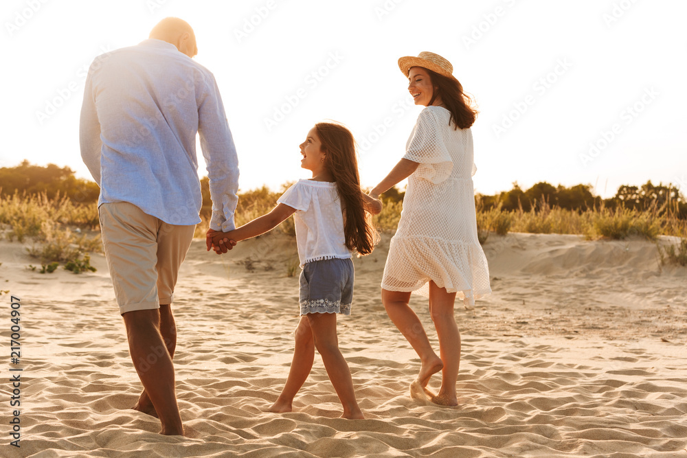 Happy family having fun together at the beach. Happy family having fun together at the beach.