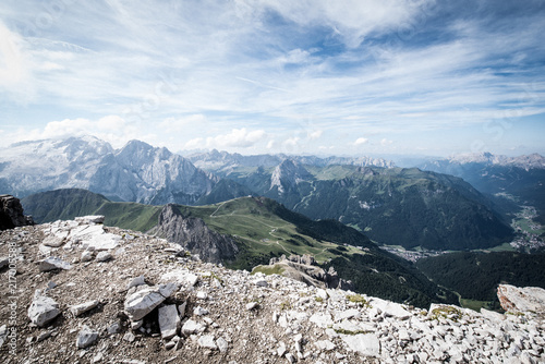 View of the Val di Fassa valley and Dolomites mountain - UNESCO heritage - from the top of the Sass Pordoi, Canazei.