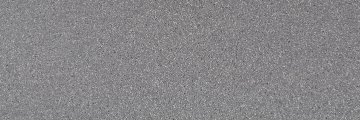 Background of gray granite with a texture of black and white spots.