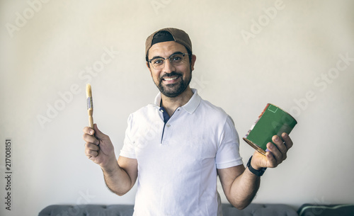 arab man renovating a wooden table photo