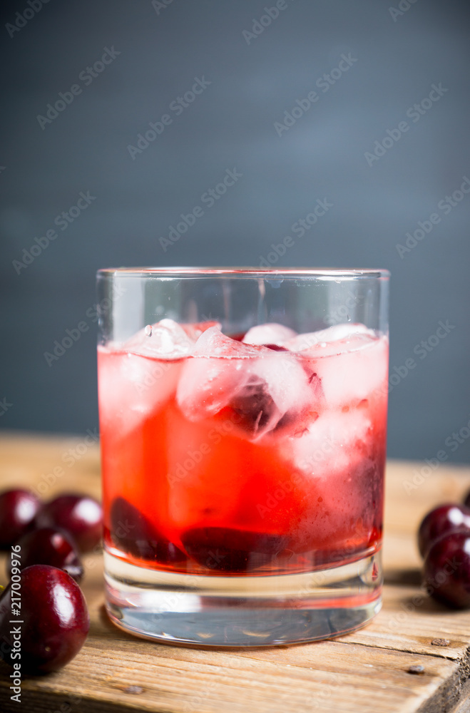 Old fashioned cocktail with cherry. Selective focus. Old fashioned cocktail with cherry. Selective focus.