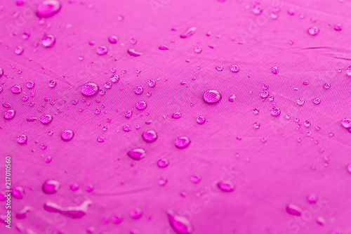 water dripped on pink umbrella