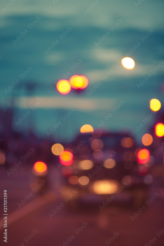 Blur traffic road with colorful bokeh light and old building town abstract background,retro tone. Blur traffic road with colorful bokeh light and old building town abstract background,retro tone.