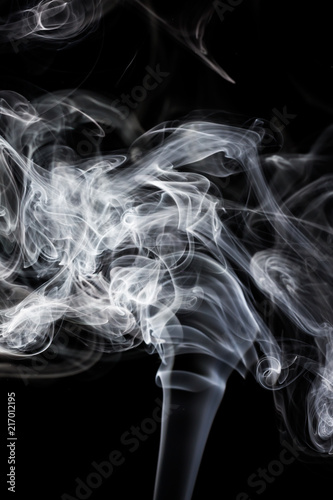 Movement of smoke,Abstract white smoke on black background © warongdech