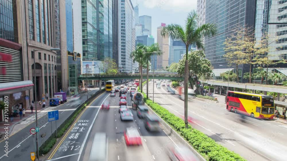 Hong Kong traffic with skyscrapers street panorama time-lapse  China. pan up
