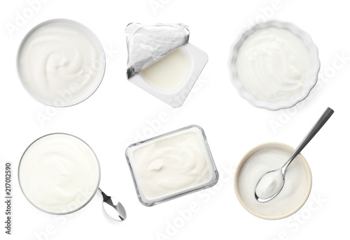 Set with delicious yogurt on white background, top view