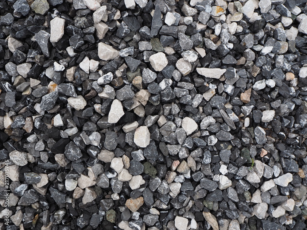 Gravel texture background. Dark grey with white gravel.