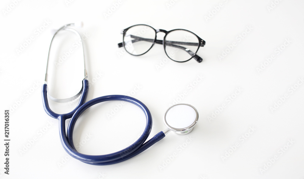 Stethoscope and spectacles on white background. Doctor stethoscope on a white background with space for text. Stethoscope and spectacles on white background. Doctor stethoscope on a white background with space for text.