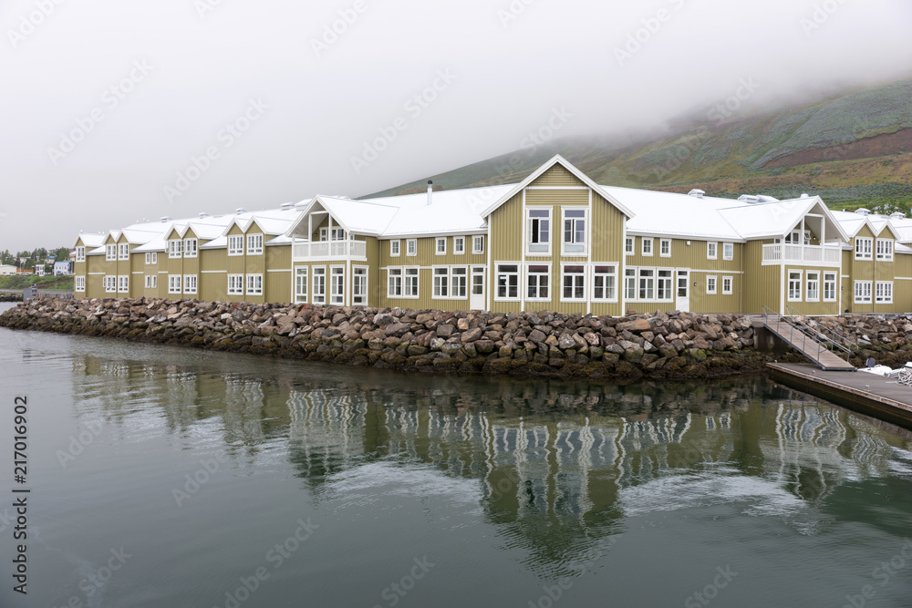 Wooden houses in Siglufjördur, former center of herring fishing in the north of Iceland Wooden houses in Siglufjördur, former center of herring fishing in the north of Iceland