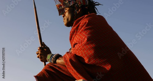 Tribal man relaxing on a rock 4k