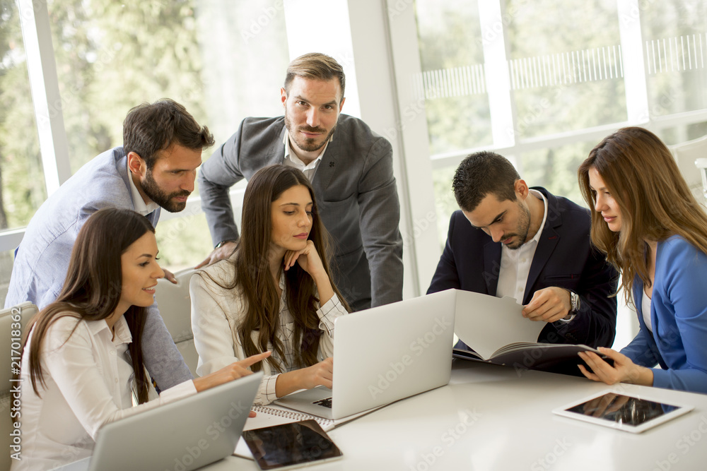Business people brainstorming in office during conference Business people brainstorming in office during conference