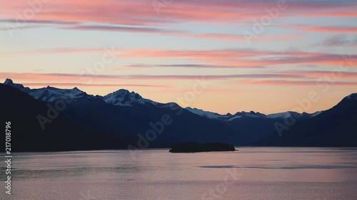 A colorful sunrise highlights the incredible scenery of Endicott Arm, a glacier fjord near Juneau, Alaska. photo