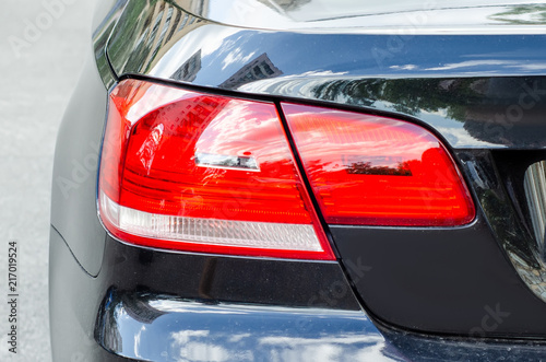 Vehicle tail lights black in the street