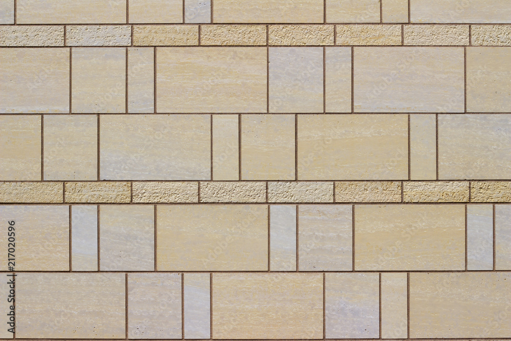 Modern stone tile wall background with a marble looking beige stones arranged in a stained glass style Modern stone tile wall background with a marble looking beige stones arranged in a stained glass style