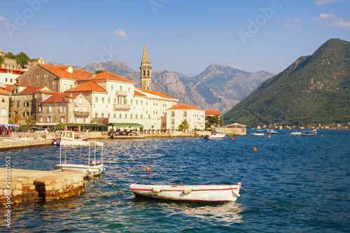 Sunny Mediterranean landscape. Montenegro, Bay of Kotor. View of the ancient town of Perast with the bell tower of the church of St. Nicholas