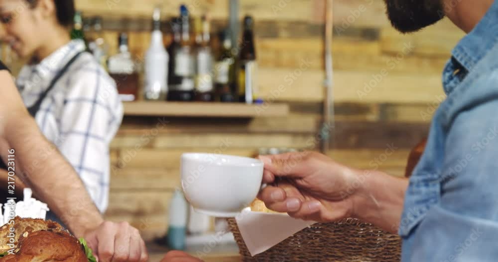 Male customer having coffee at counter 4k Male customer having coffee at counter 4k